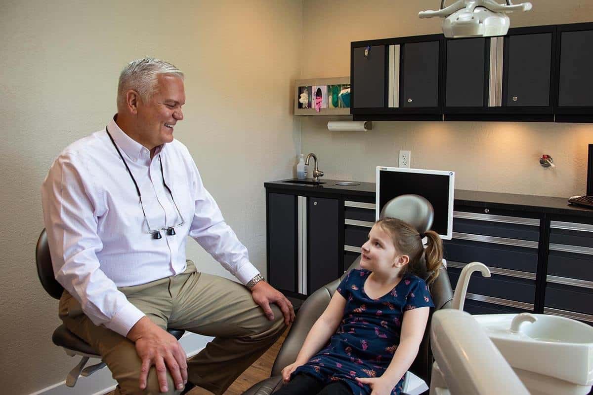 Dr. Pawlowicz with a child patient