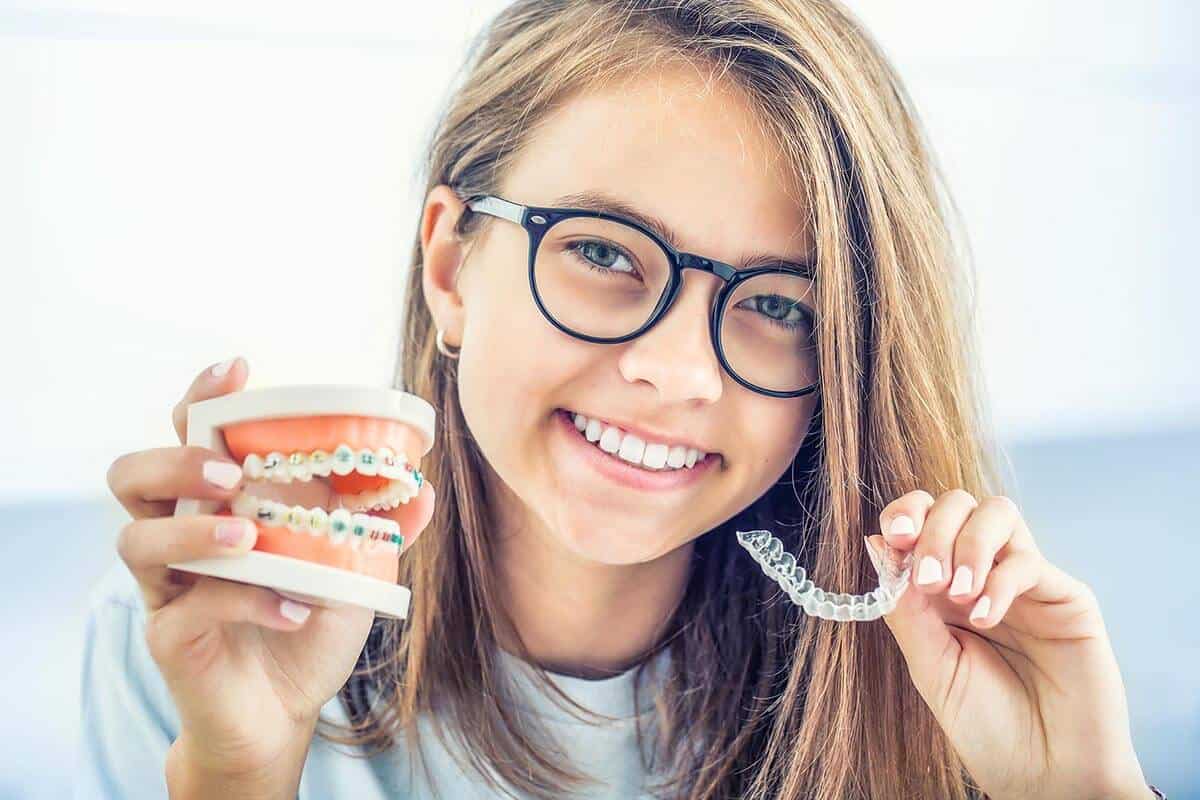 False teeth with braces and ortho hovering over